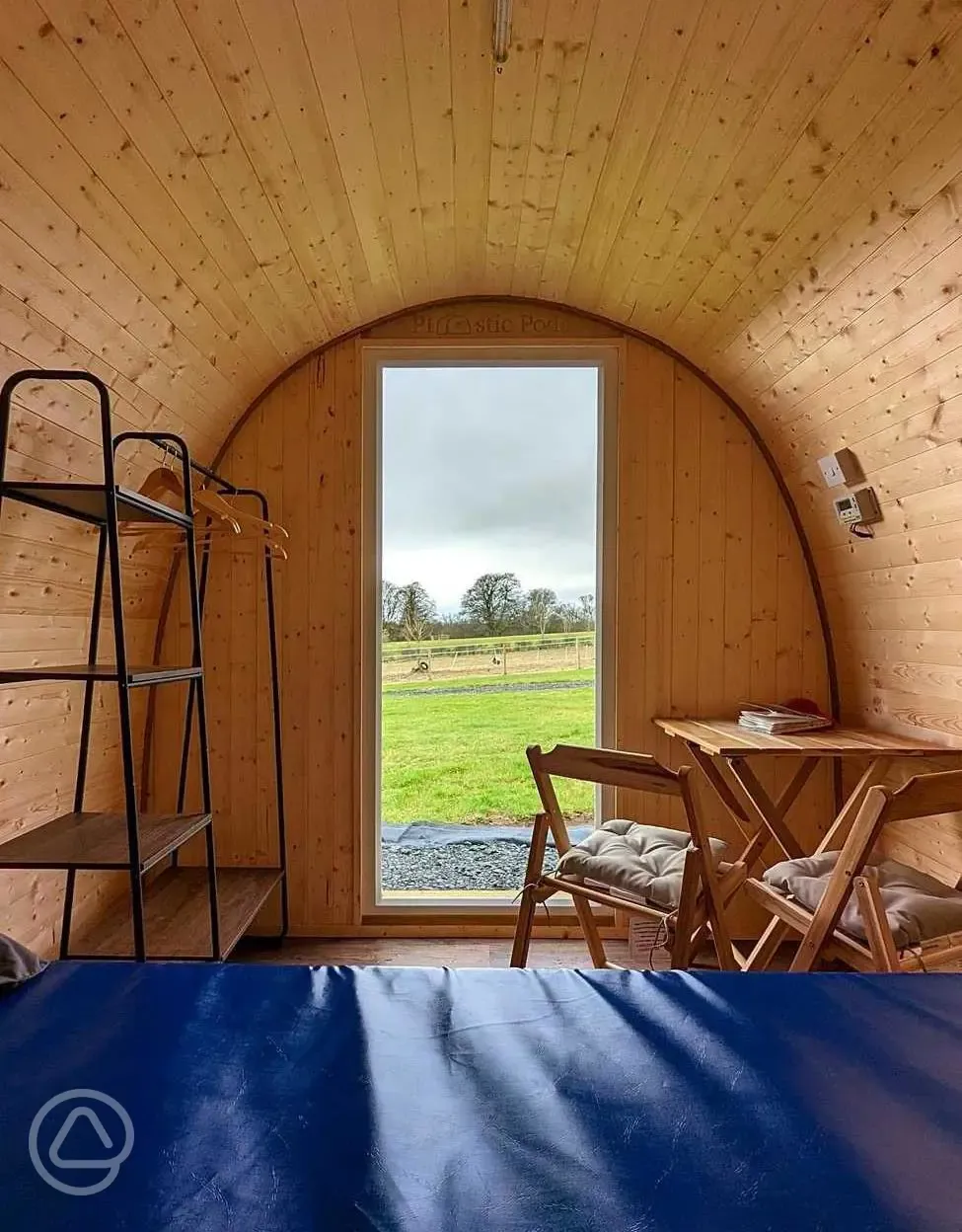 View out of a green camping pod
