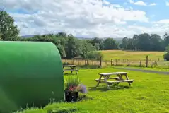 Green camping pods countryside views