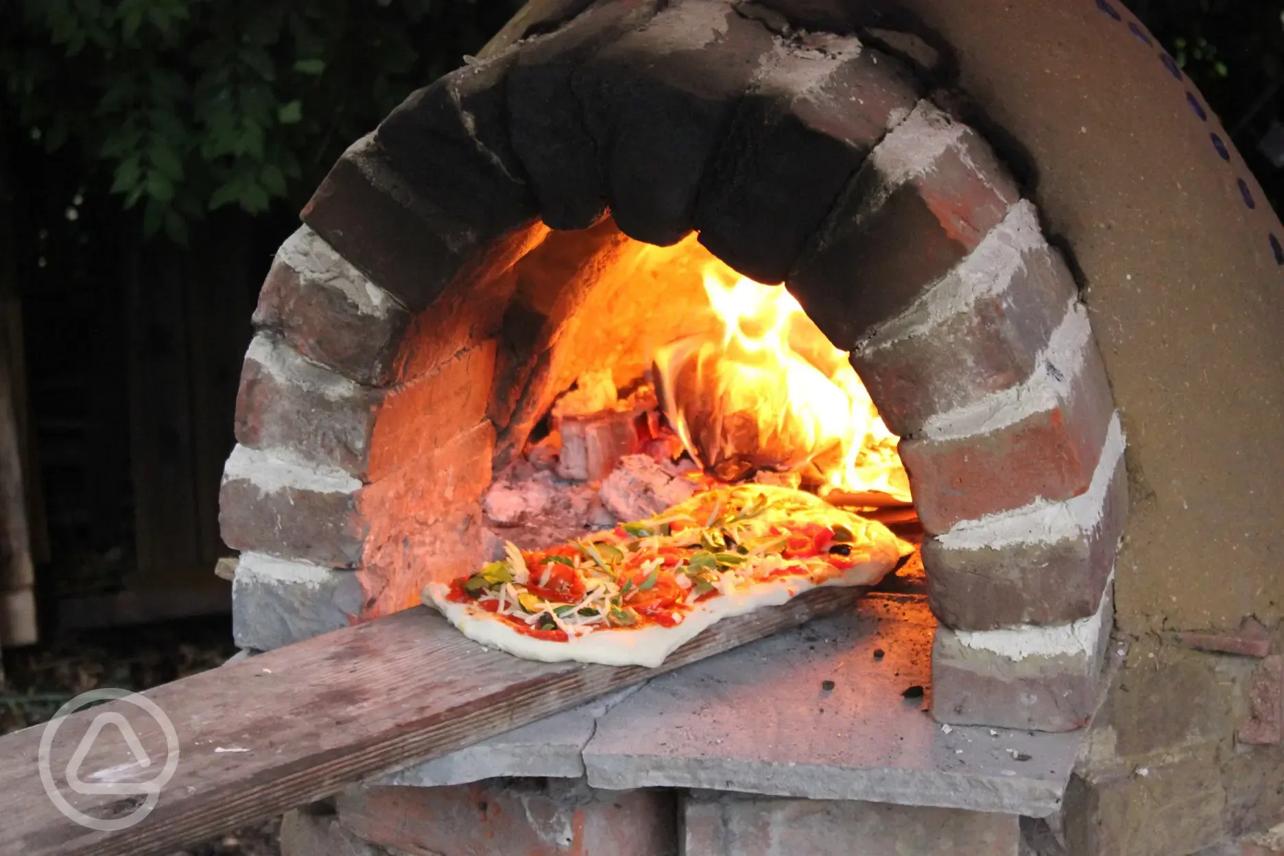 the wood fired pizza oven is popular with guests