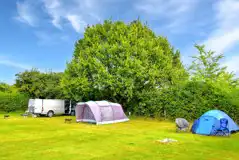 Non electric grass pitches with sunken fire pits