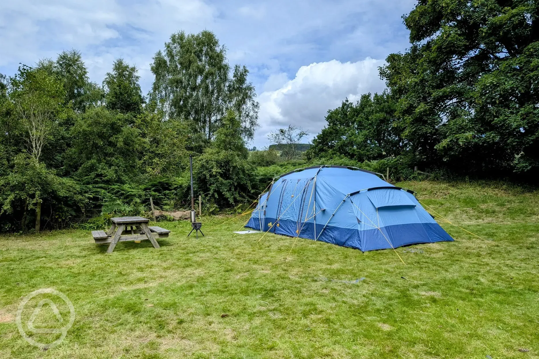 Non electric large tent pitch with a picnic bench