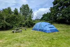 Non electric large tent pitch with a picnic bench