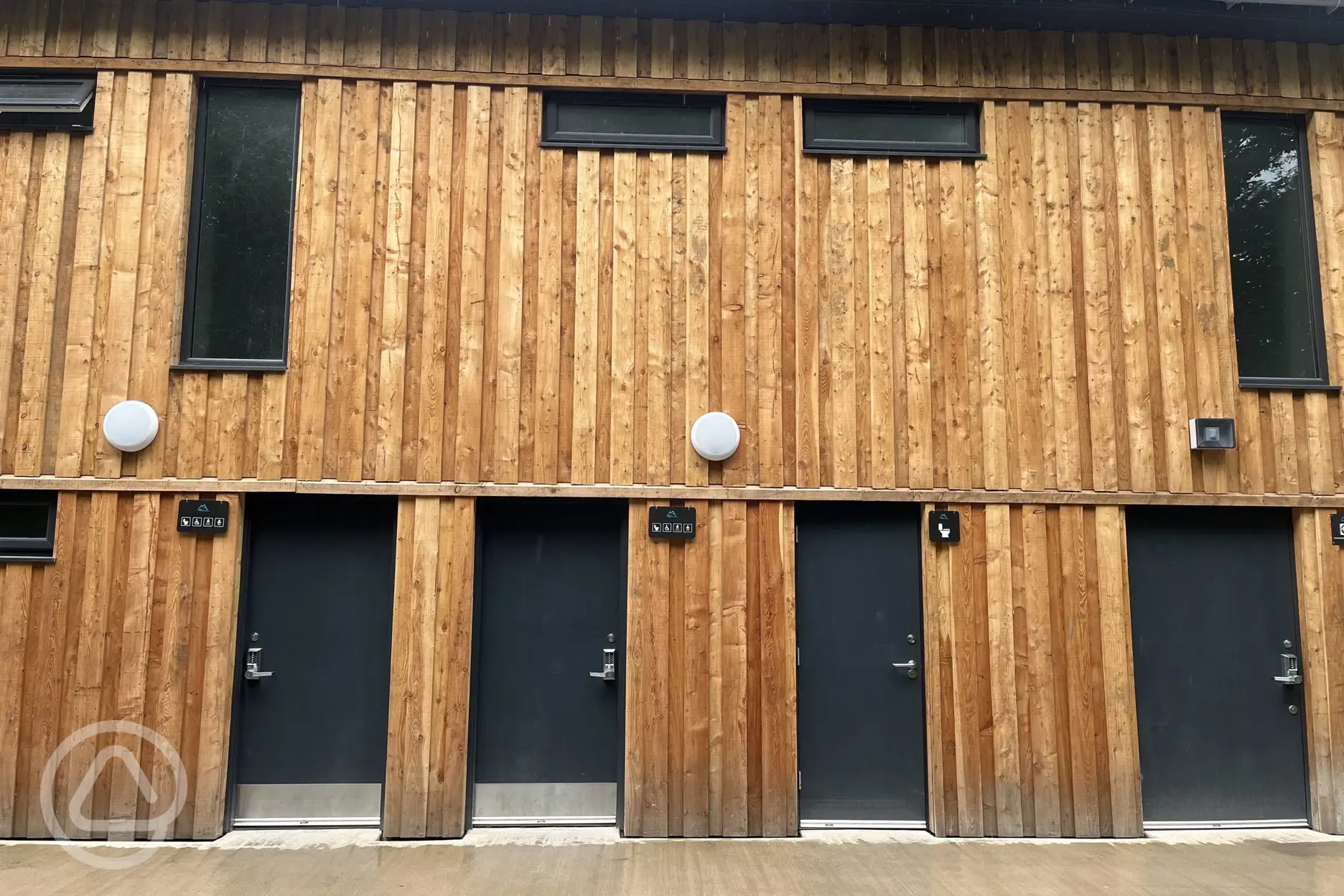 Self contained toilets, sinks, hot showers - gender neutral common areas