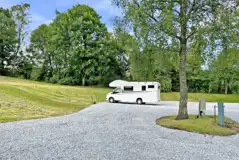 Large electric hardstanding pitches at Grandtully Station Campsite