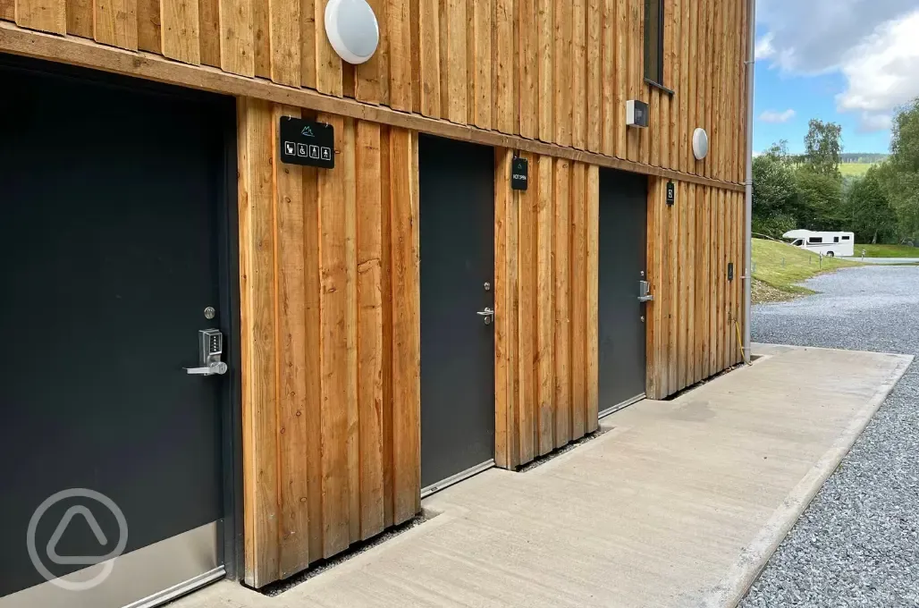 Facility block with 14 self contained toilets, sinks and hot showers 