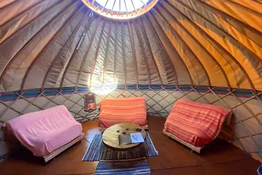 Yurt with a double and two single futon beds (with bedding)