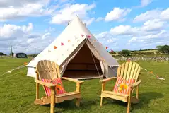 Unfurnished bell tents with outdoor seating Unfurnished bell tents with outdoor seating