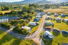 Aerial of Llwyn Bugeilydd with grass and hardstanding pitches