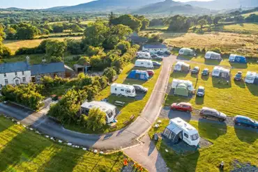 Aerial of Llwyn Bugeilydd with grass and hardstanding pitches