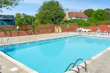 Heated outdoor swimming pool with loungers (open during summer)