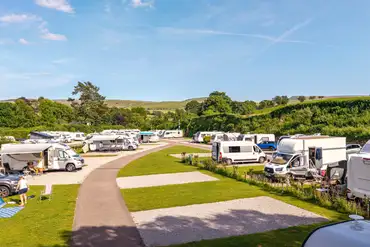 Aerial of the electric grass and hardstanding pitches with countryside views