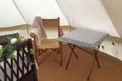 Seating area in the Goldfinch bell tent Seating area in the Goldfinch bell tent