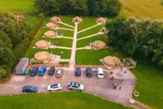 Aerial of the bell tents with path access