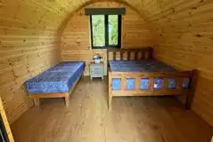 Family pods featuring double bed and single bed