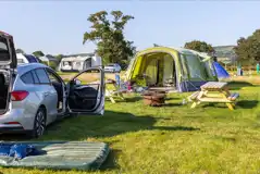 Electric grass pitches with fire pits and picnic benches