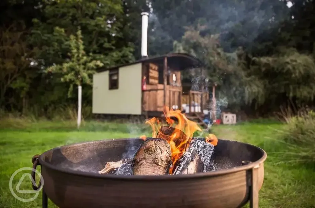 Shepherd's hut with fire pit