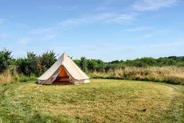 Bell tent in a mown circular pitch