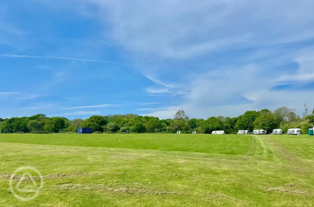 View of grass pitches and airstreams