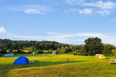 Newbourne Woodland Campsite with picnic benches and countryside views