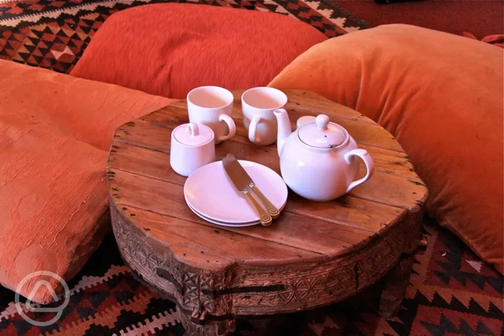 Tea and plates on table