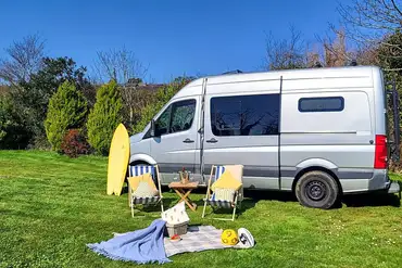 Grass pitch with a 16 amp hook up for tourers at Cambrose Camping and Touring