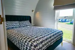 Side entry pod bedroom with a double bed (bedding provided) Side entry pod bedroom with a double bed (bedding provided)