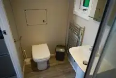 Elite pod ensuite bathroom with a toilet and shower Elite pod ensuite bathroom with a toilet and shower