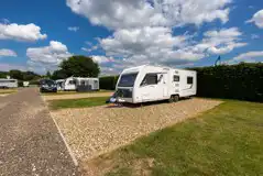 Electric hardstanding gravel touring pitches with 10 amp hook up Electric hardstanding gravel touring pitches with 10 amp hook up