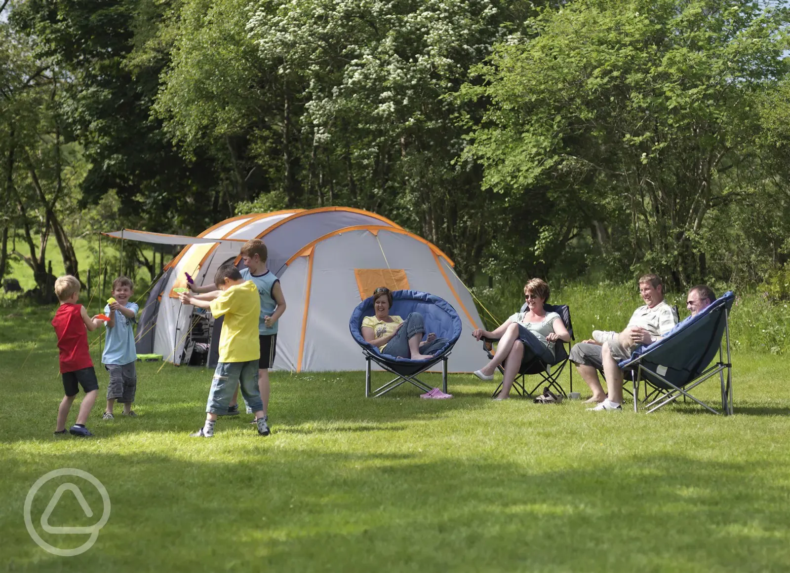 Family playing by their tent