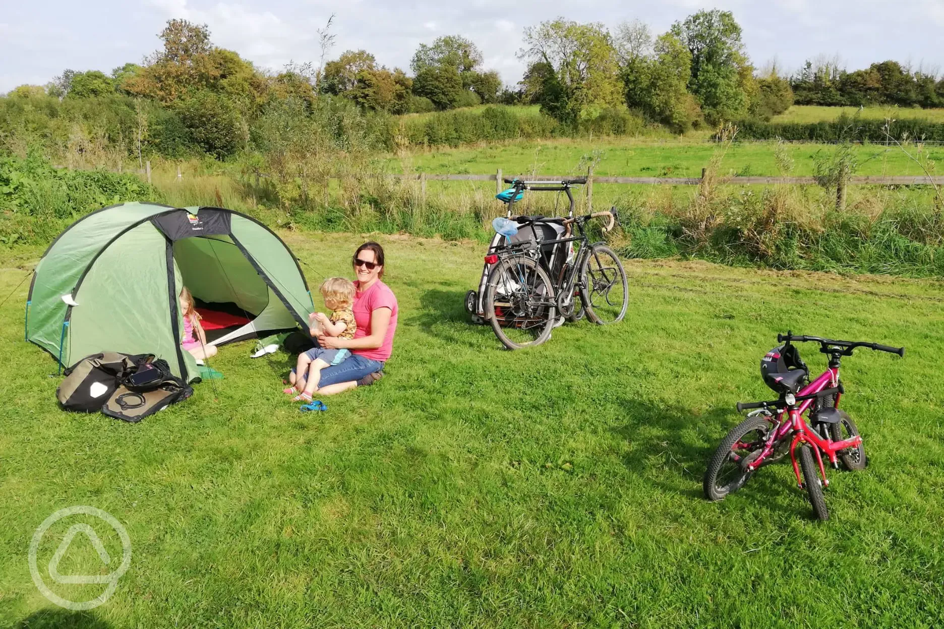 Family camping on the field