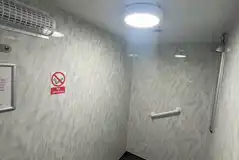 Shower in communal facility block Shower in communal facility block