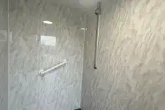 Shower in communal facility block Shower in communal facility block