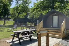 Superior camping pod with its own patio with picnic table and barbecue station Superior camping pod with its own patio with picnic table and barbecue station