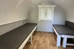 Seating which converts to beds in the superior camping pod Seating which converts to beds in the superior camping pod