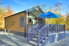 Ensuite glamping cabins with step access and private decks with seating Ensuite glamping cabins with step access and private decks with seating