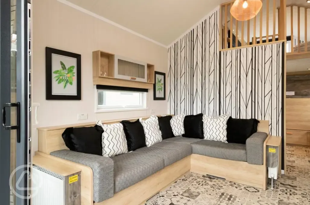 Ensuite glamping cabin double L-shaped sofa bed (bedding provided)