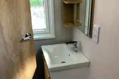 Glamping pod bathroom with a shower, sink and toilet (bring or hire towels) Glamping pod bathroom with a shower, sink and toilet (bring or hire towels)