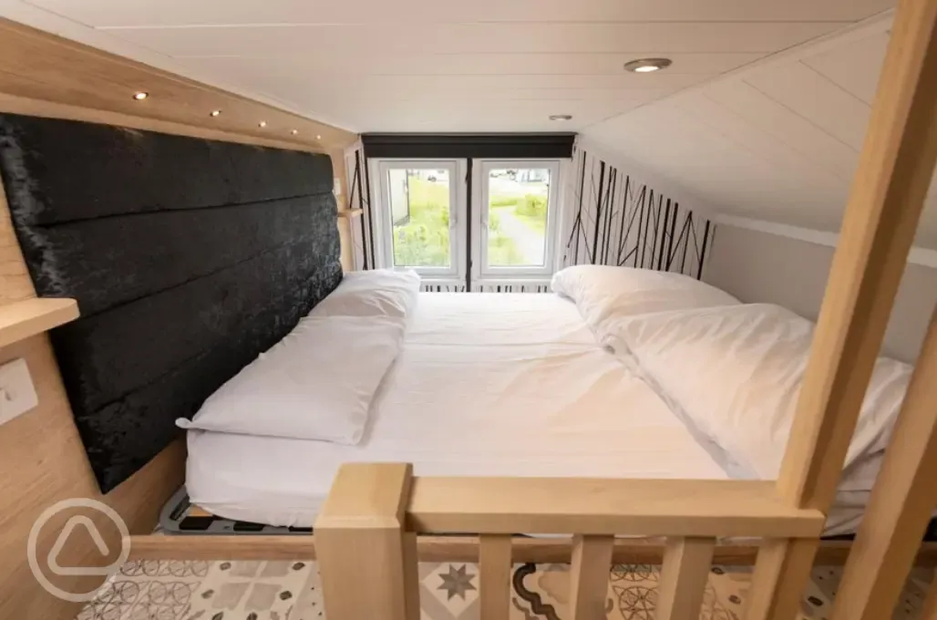 Ensuite glamping cabin mezzanine twin bedroom (accessed by a step ladder)