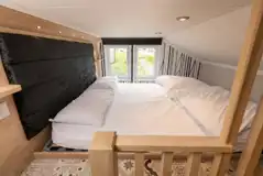 Ensuite glamping cabin mezzanine bedroom