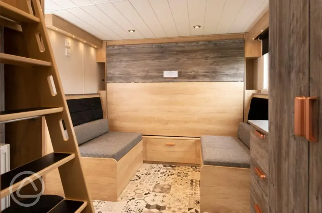 Ensuite glamping cabin convertible dining area (folds to a double bed)