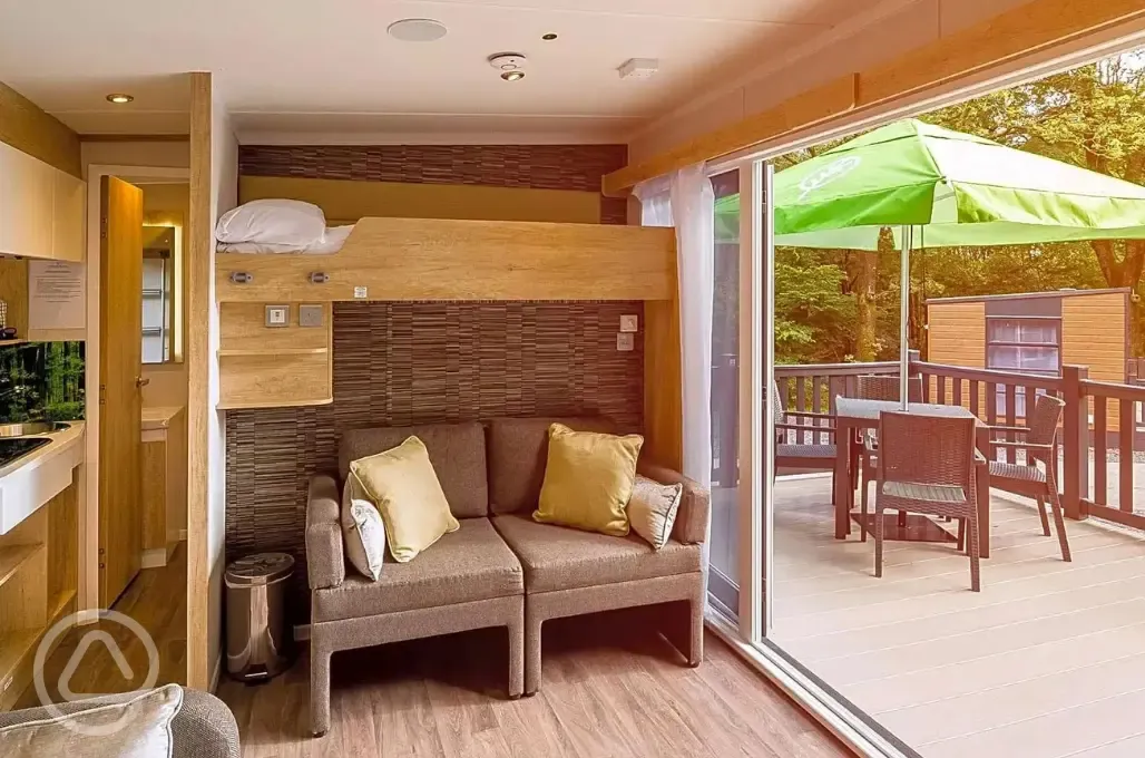 Ensuite glamping pod sofa bed, bunk bed and small kitchenette