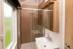 Glamping cabin bathroom with a shower, sink and toilet (bring or hire towels) Glamping cabin bathroom with a shower, sink and toilet (bring or hire towels)