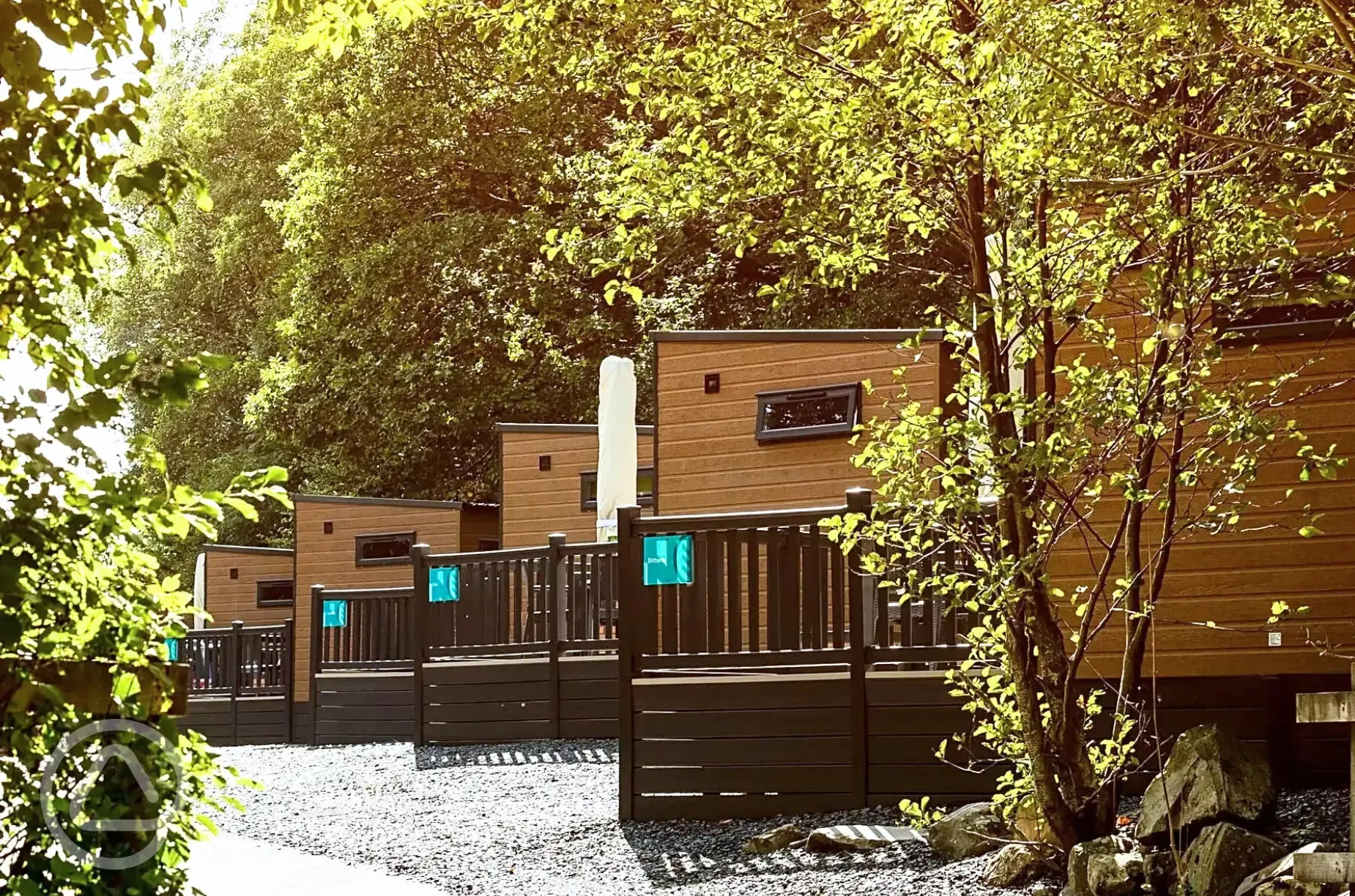 Ensuite glamping pods with raised decking areas and outdoor seating