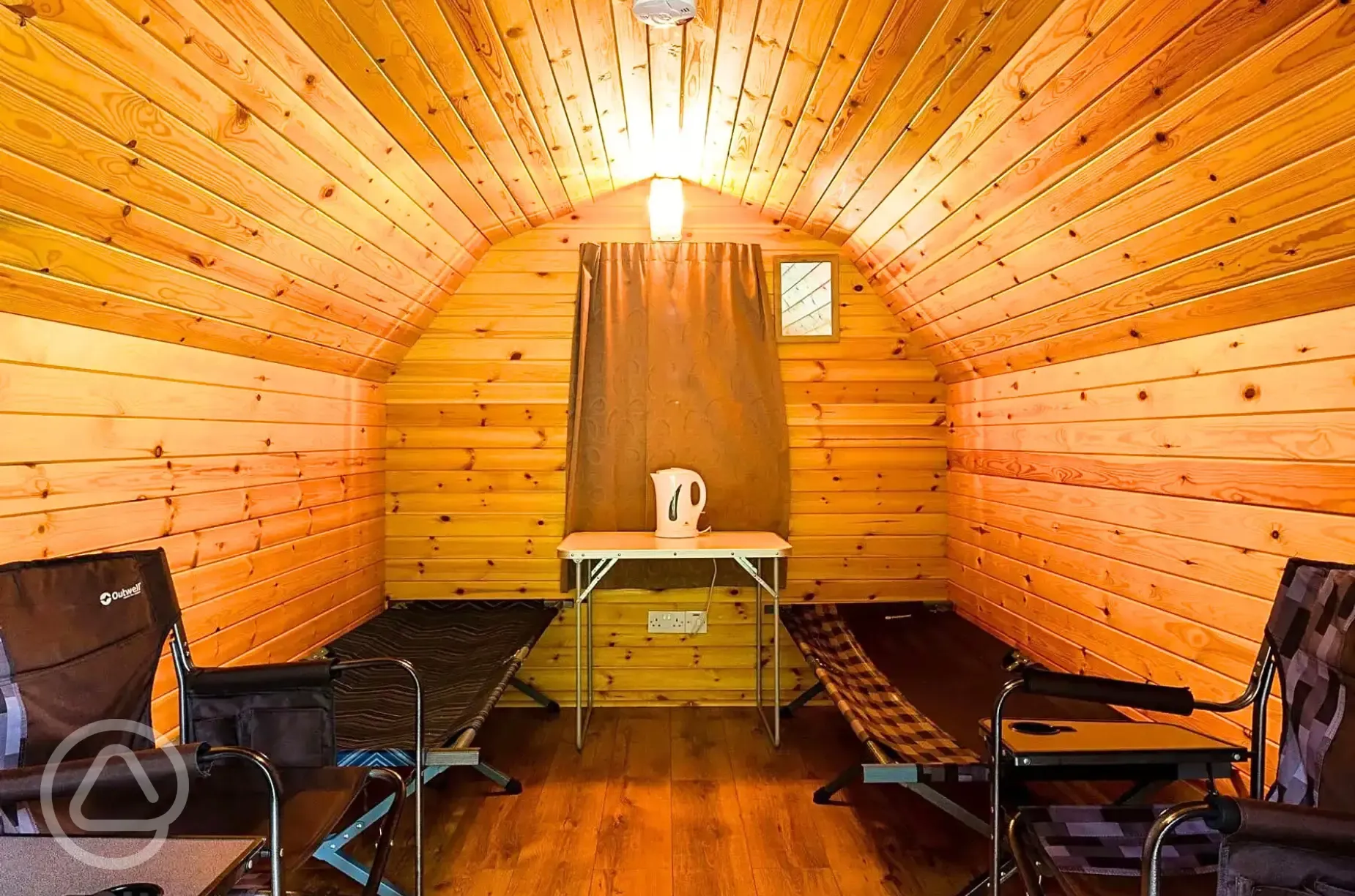 Camping pod interior with two single camp beds (bring own bedding)