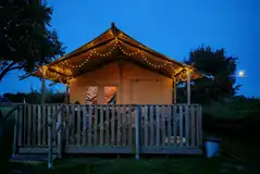 Safari tent at night with fairy lights Safari tent at night with fairy lights