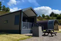 Ensuite glamping cabins with covered outdoor deck areas and brick BBQs Ensuite glamping cabins with covered outdoor deck areas and brick BBQs