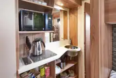 Glamping pod kitchen with a hob, microwave, kettle, toaster and sink Glamping pod kitchen with a hob, microwave, kettle, toaster and sink