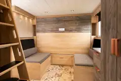 Glamping cabin dining area with a pull-down double bed Glamping cabin dining area with a pull-down double bed