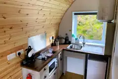 Accessible glamping pod kitchen area with a microwave, fridge, kettle, toaster Accessible glamping pod kitchen area with a microwave, fridge, kettle, toaster