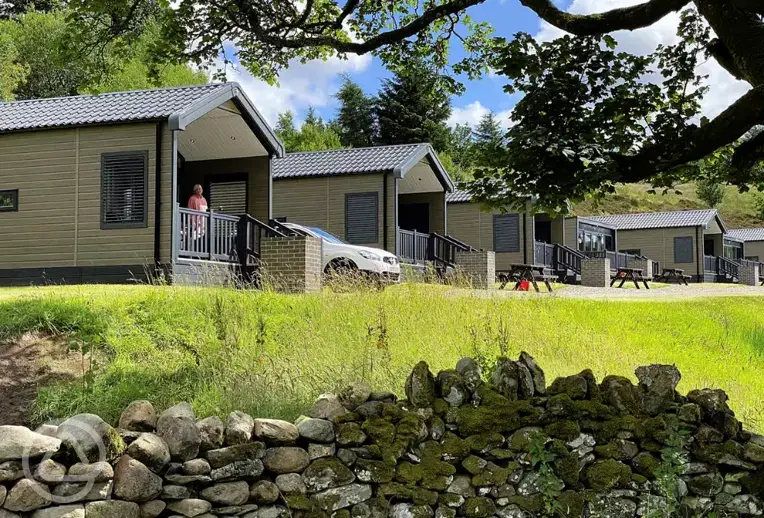 Ensuite glamping cabins with covered outdoor deck areas